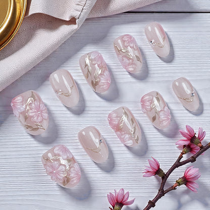  Detail shot of flower embellishments and shimmer finish on Sakura Glint nails