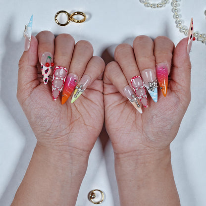 Close-up of hands with colorful nail art on a white background