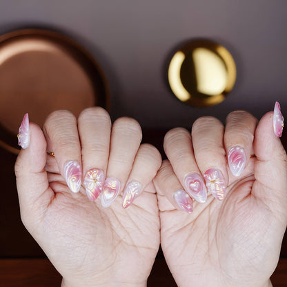 Palm-up hand position showing full Twilight Bloom nail set, lit under warm lighting to highlight shimmer and sculpting.