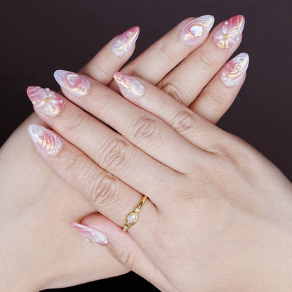 Relaxed hands showing the entire nail set with gloss topcoat, soft pastel blend, and dimensional art.