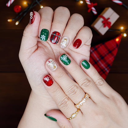 Hand pose showing glossy red and green holiday nails