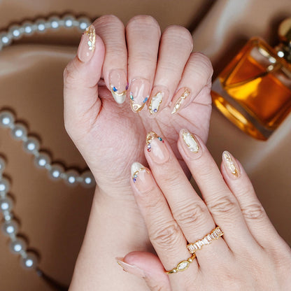 Shimmery blush chrome nails with 3D flowers and petal details