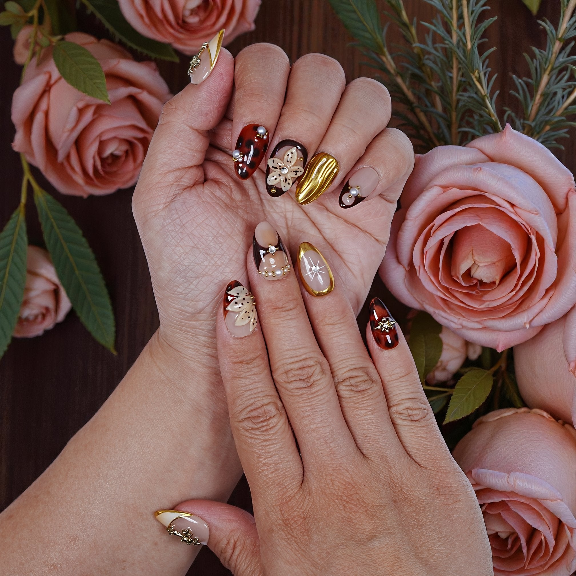 Luxury press on nails photographed with soft fabric background