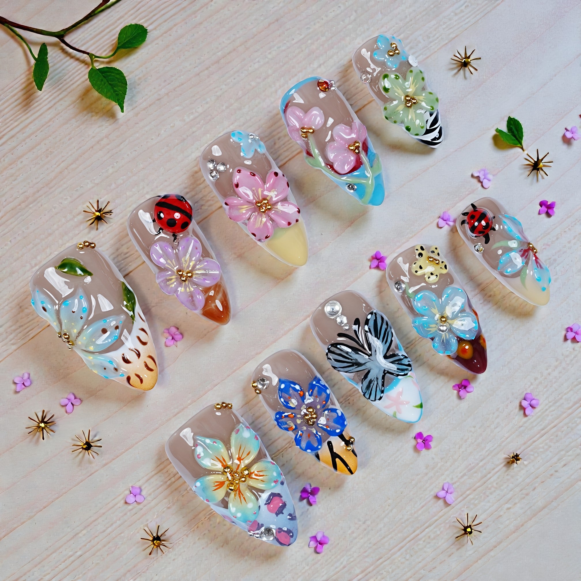 Handmade press on nails with 3D floral and butterfly designs, premium salon quality styles